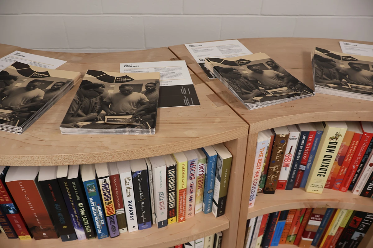 Natural wood bookshelves filled with books.